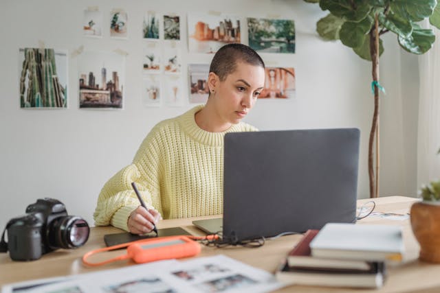 Professional photographer editing photos for an NYC property listing