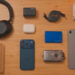 Everyday carry gear sits neatly on a wooden desk