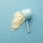 White supplement powder measured in a scoop, illustrating collagen powder use.