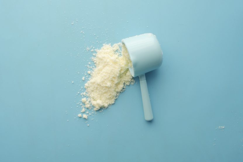 White supplement powder measured in a scoop, illustrating collagen powder use.