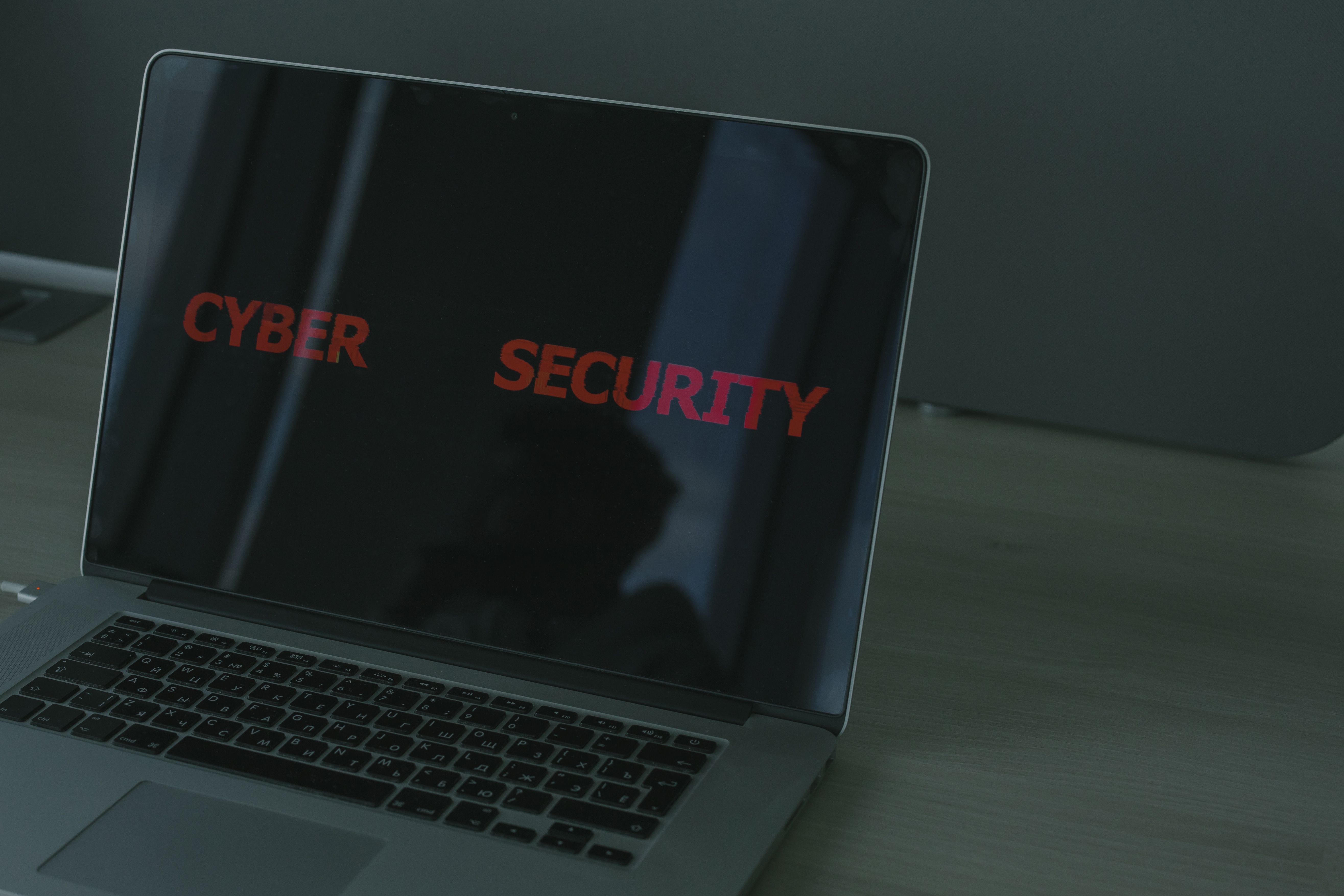 Laptop displaying cybersecurity concepts, representing digital safeguards for sensitive client information.